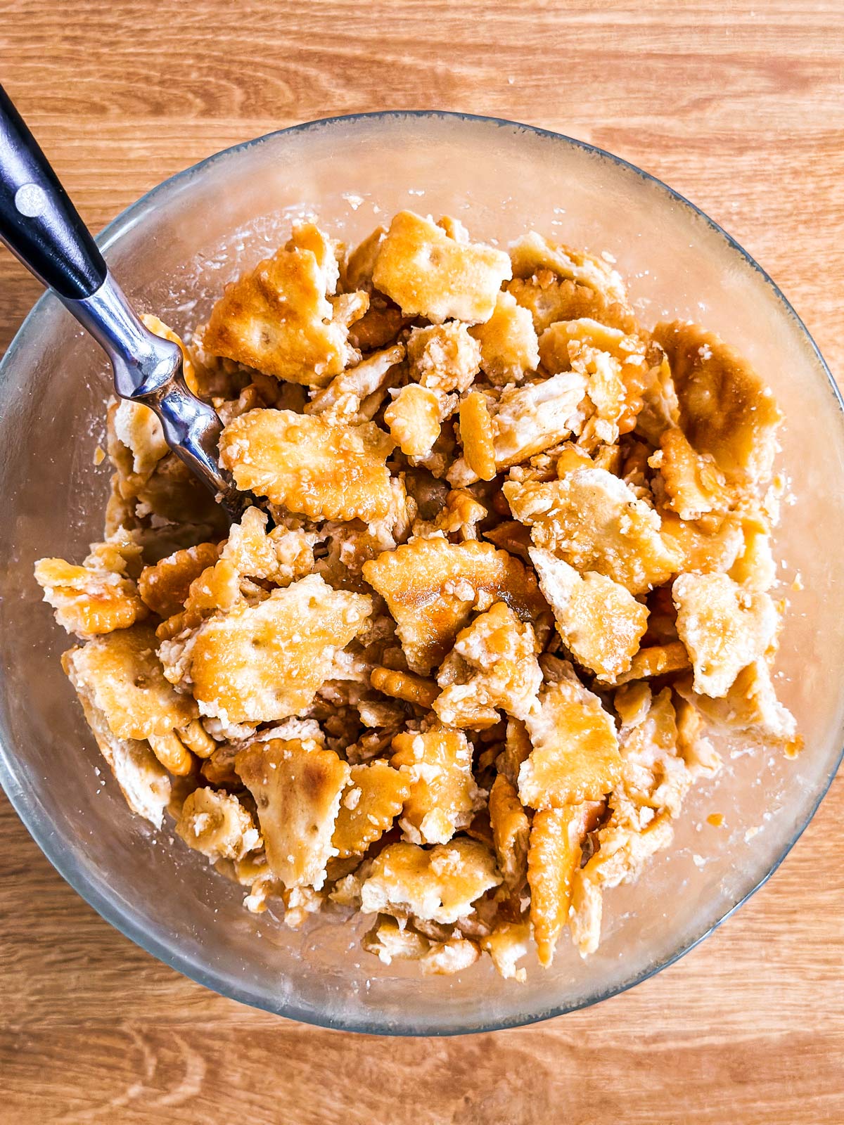 overhead view of cracker casserole topping in glass bowl