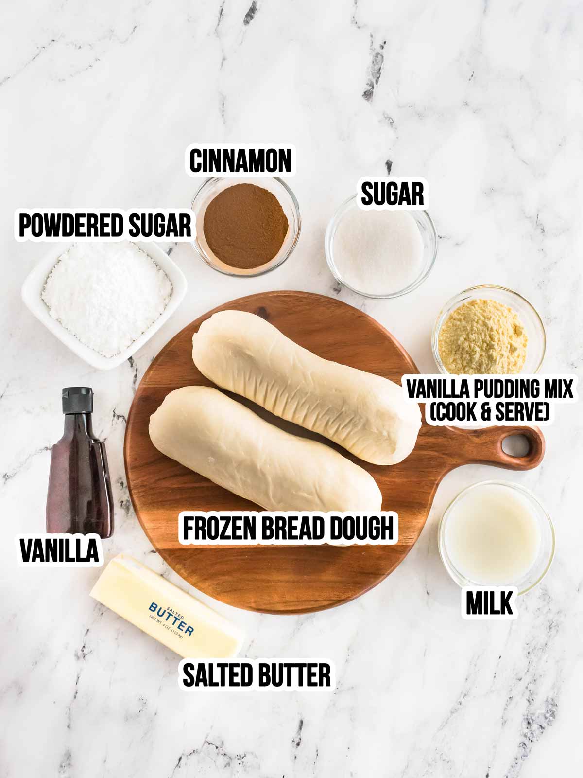 overhead view of ingredients to make cinnamon roll casserole with text labels