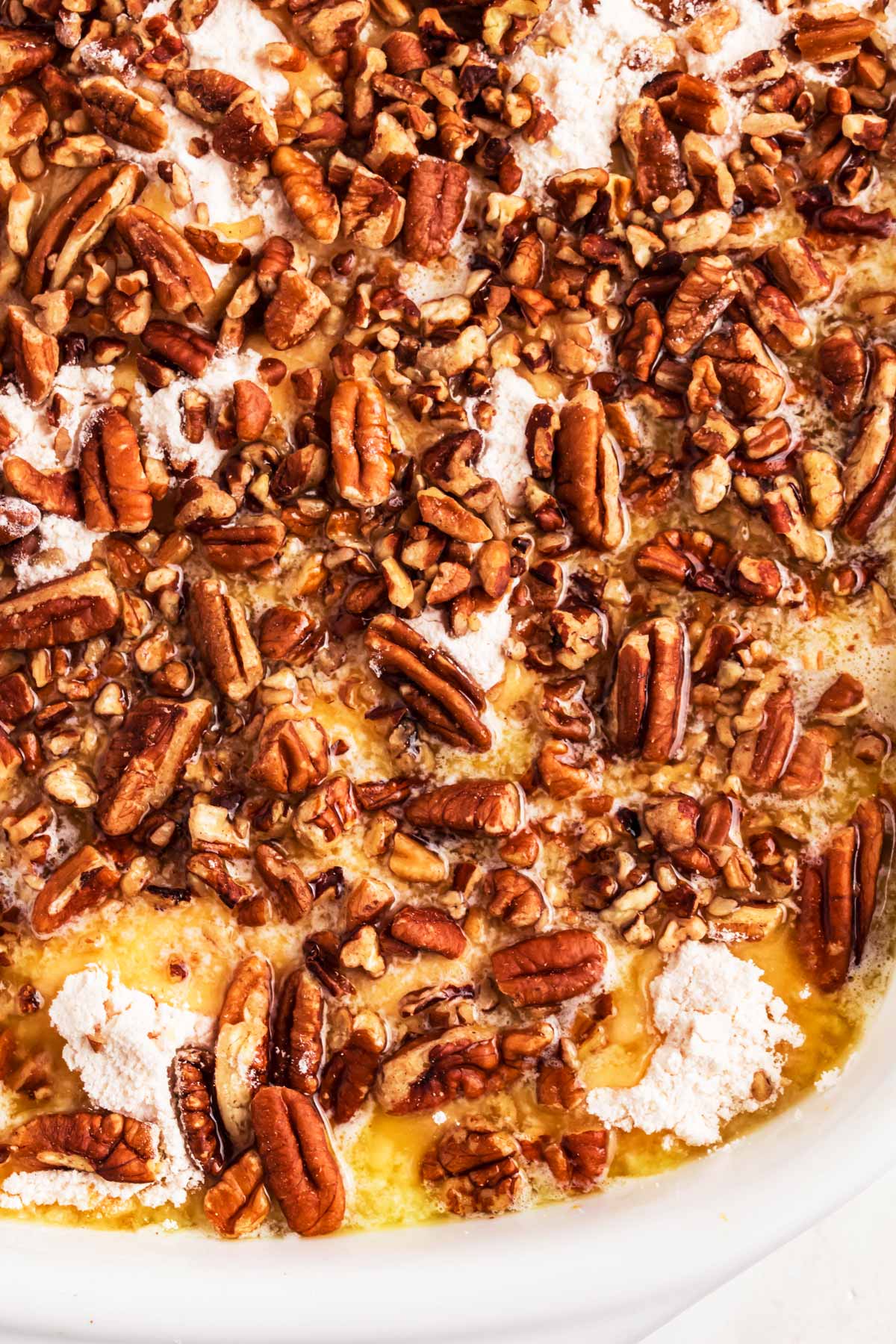 overhead close up view of unbaked pumpkin dump cake