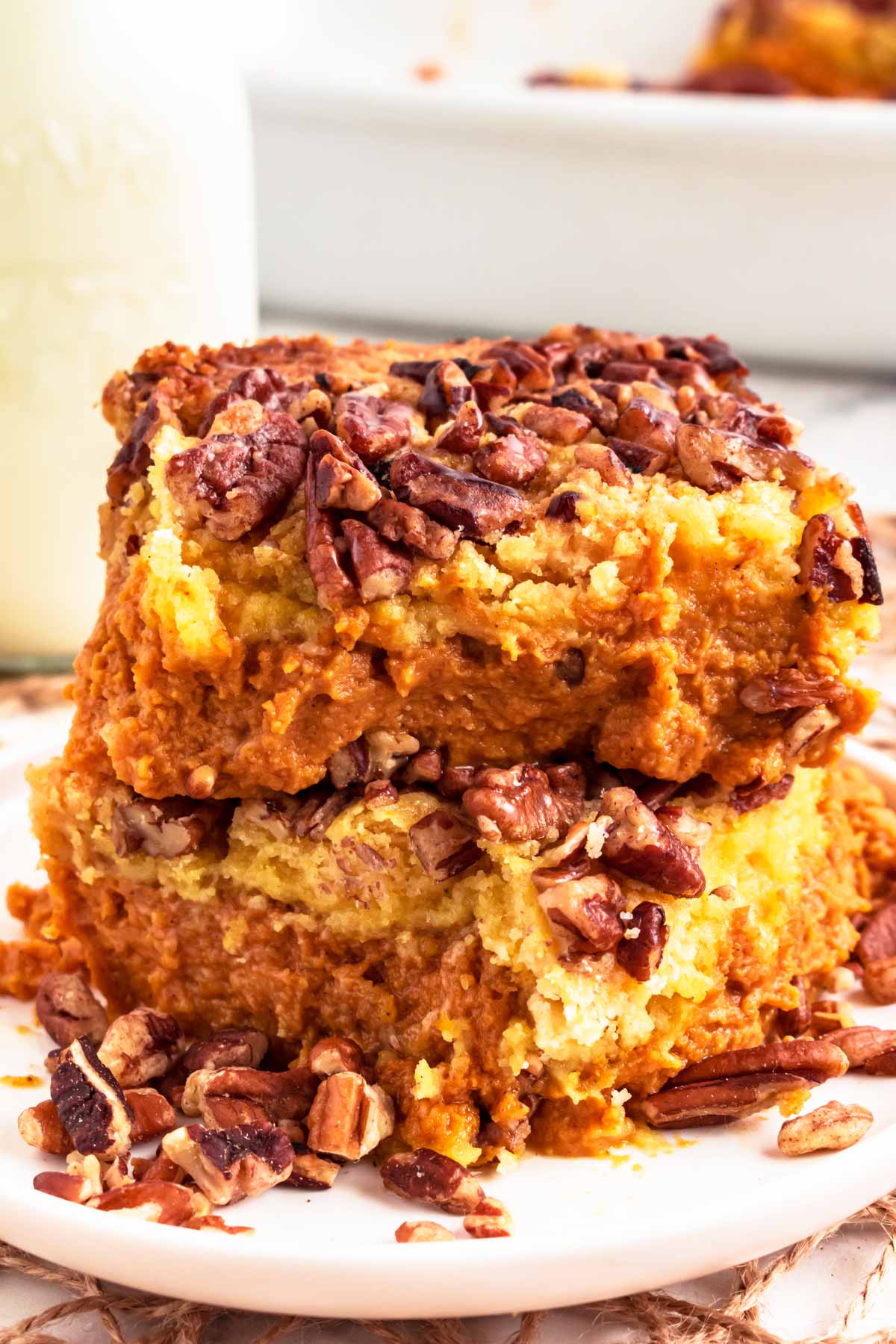 frontal view of two slices of pumpkin dump cake stacked on top of each other