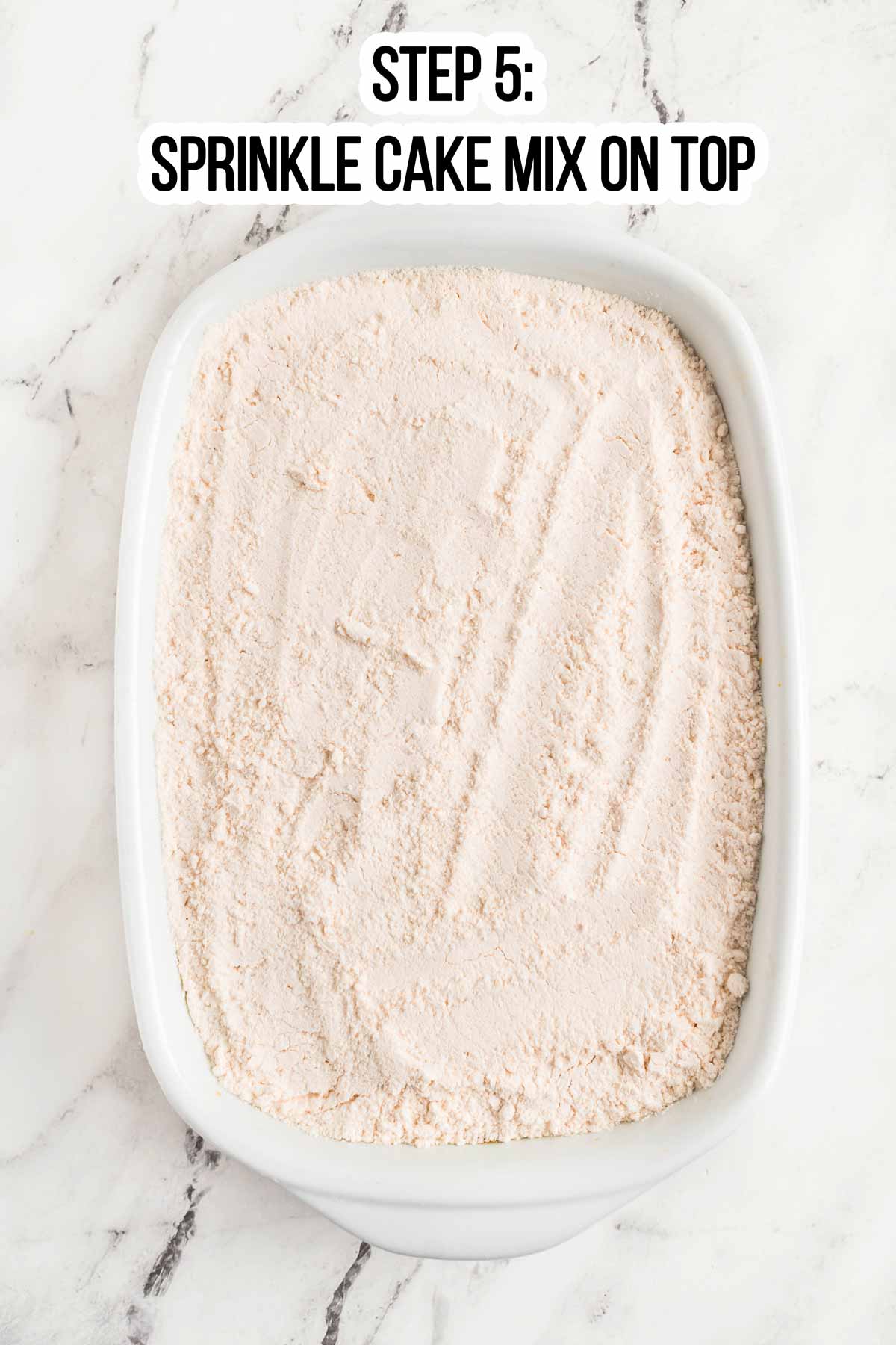 overhead view of cake mix in white casserole dish