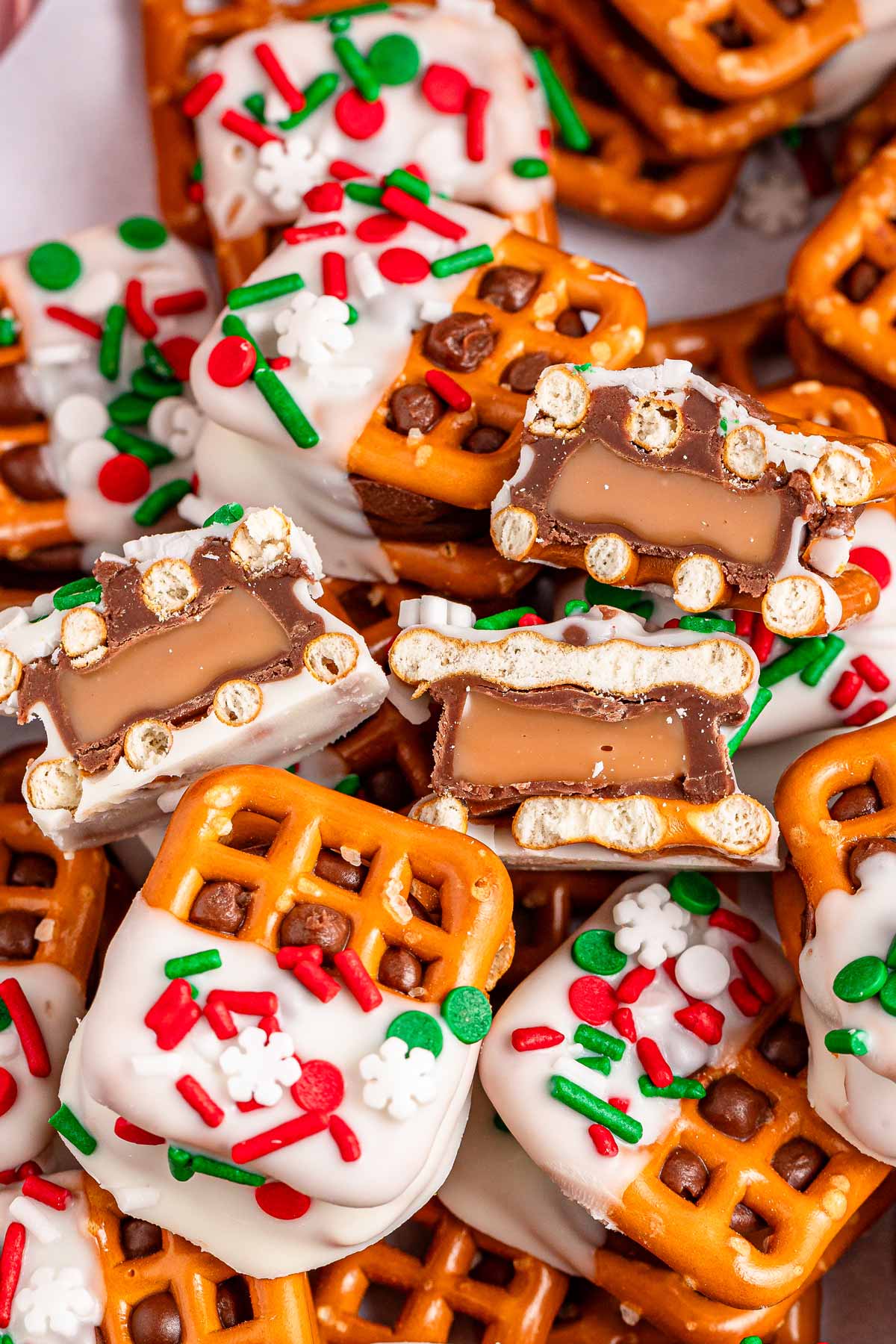 overhead view of three halved Rolo bites in a pile of whole Rolo pretzel bites