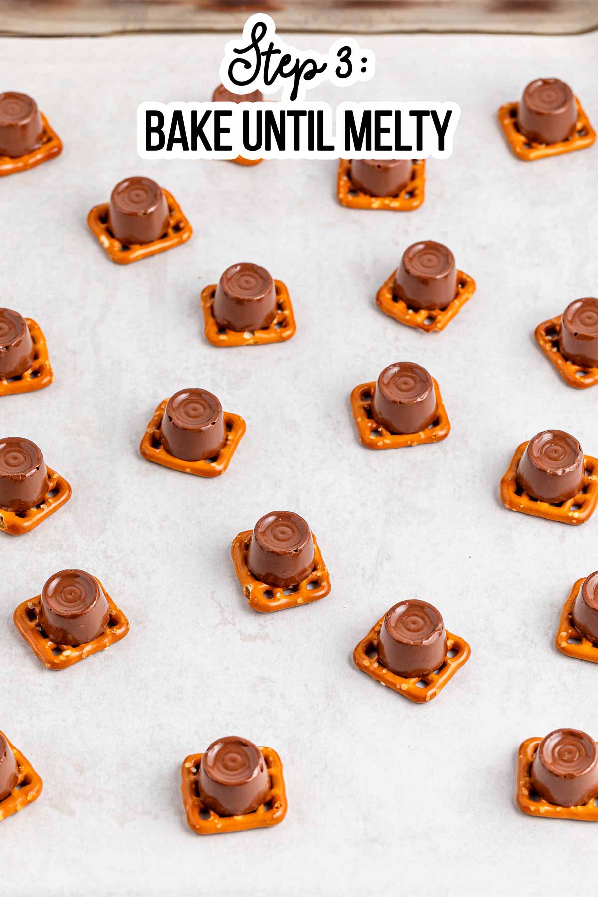 frontal view of pretzel shapes with softened chocolates on top